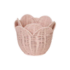 A small, pink Olli Ella Rattan Lily Basket Set designed in the shape of a blooming lily, isolated on a white background.