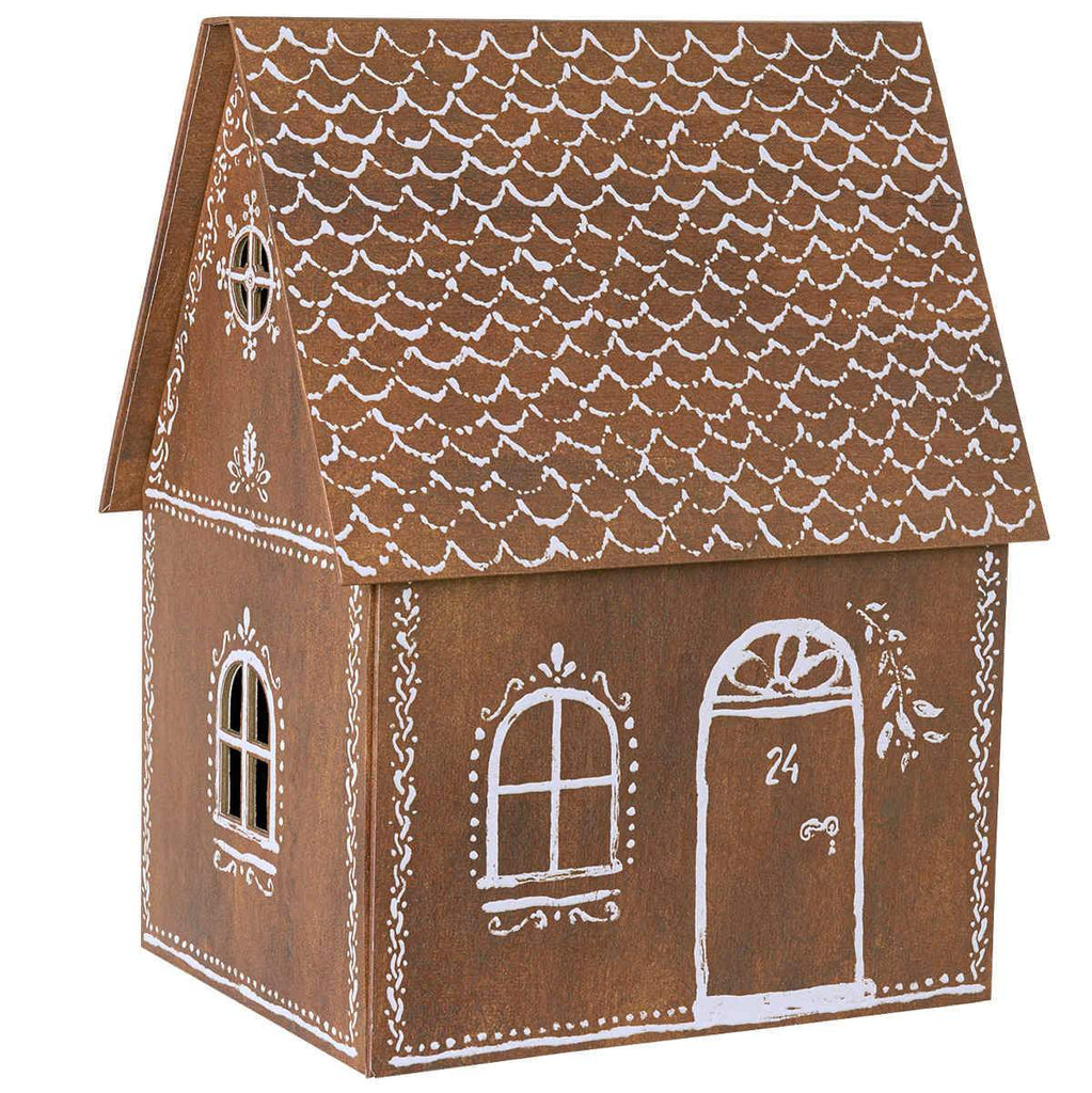 A small, brown, house-shaped decorative item features white painted details including scalloped roof patterns, windows with arches, and an arched door with the number "24" on it. Intricate designs adorn the edges, giving it a Maileg Cardboard Gingerbread House appearance. Perfect for holiday surprises!