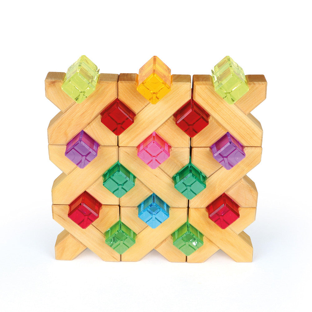 A complex lattice structure of interlocking wooden blocks with colorful translucent cubes in red, green, blue, and purple. Three rows and four columns form this symmetrical design, resembling high-quality sets like Bauspiel Luminous Blocks - 24 Piece.