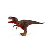 The Schleich Red Tyrannosaurus Rex Dinosaur Toy, featuring a brown body with red accents, is shown standing on a white background with its mouth open and arms raised.