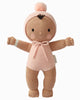 Cuddle + Kind My First Baby (Peach) ships in one week. This fair trade, hand-knit doll has brown skin, a simple embroidered face, outstretched arms, and comes dressed in a pink outfit with a matching pom-pom hat. Made from natural cotton yarn.