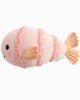 The Cuddle + Kind Baby Fish is a pink hand-knit toy with peach fins and tail, black stitched eyes, and a sweet smile—an heirloom-quality stuffed animal perfect for little ones.