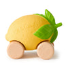 Lou The Lemon Baby Car is a yellow lemon-shaped eco-friendly baby car with green leaves, wooden wheels, and "Oli & Carol" embossed on one side—perfect for sensory play.