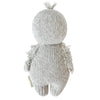 A Cuddle + Kind Baby Penguin with a simplistic humanoid shape, featuring a rounded head and body with elongated arms and legs, and fluffy, textured details on the sides. No facial features are visible.