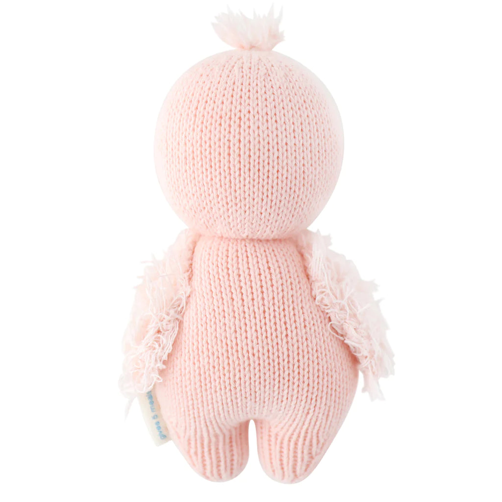 A Cuddle + Kind Baby Flamingo with a fluffy cap and wings, shown from the back against a white background.