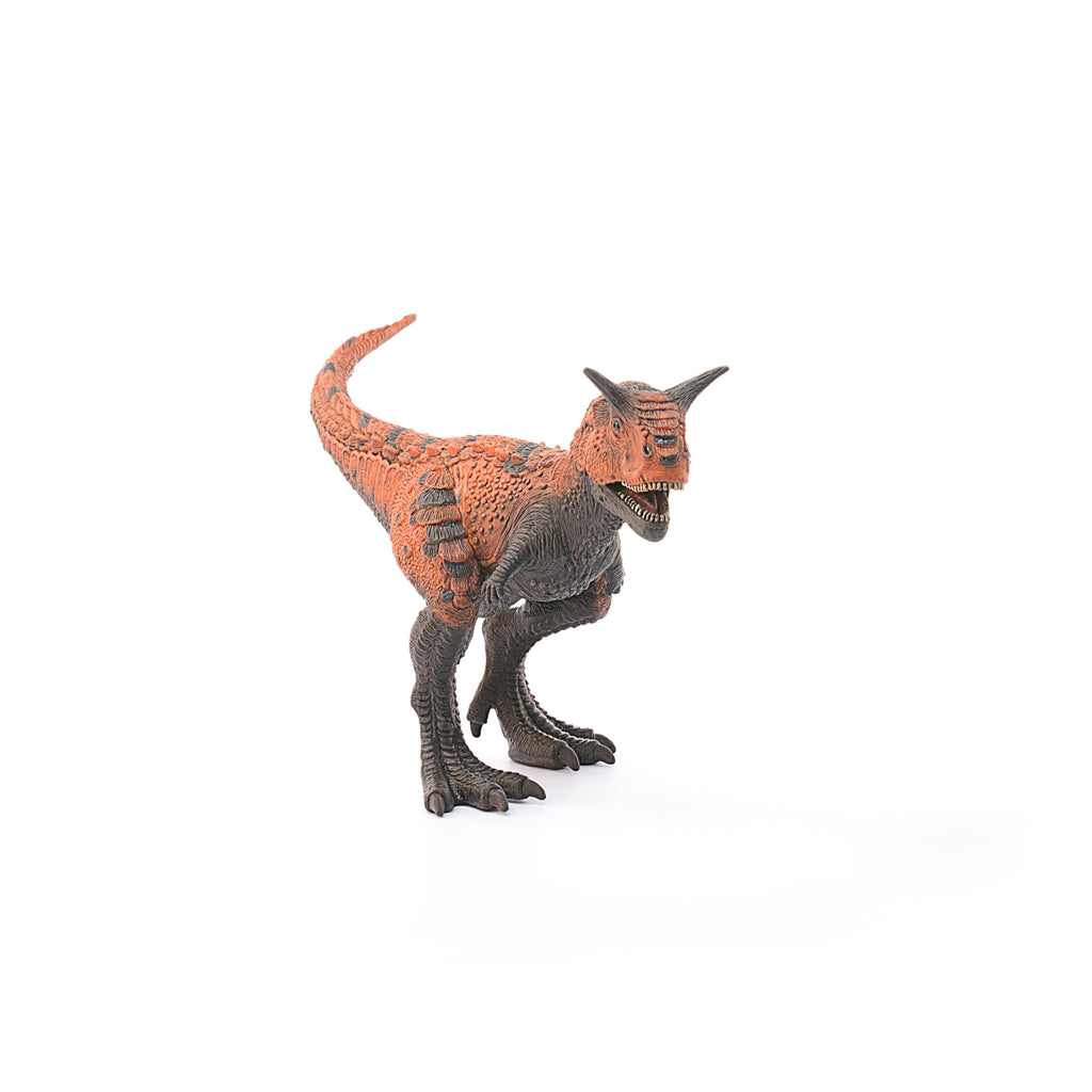 A Schleich Carnotaurus Large Realistic Dinosaur Toy With Movable Jaw stands on a white background, facing slightly to the right. This educational toy features orange and dark gray coloring, two small arms, sharp teeth, and two horns above its eyes.