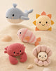 The Cuddle + Kind Baby Fish is a hand-knit, pastel-colored stuffed animal with a smiling face—a perfect heirloom-quality gift for little ones.