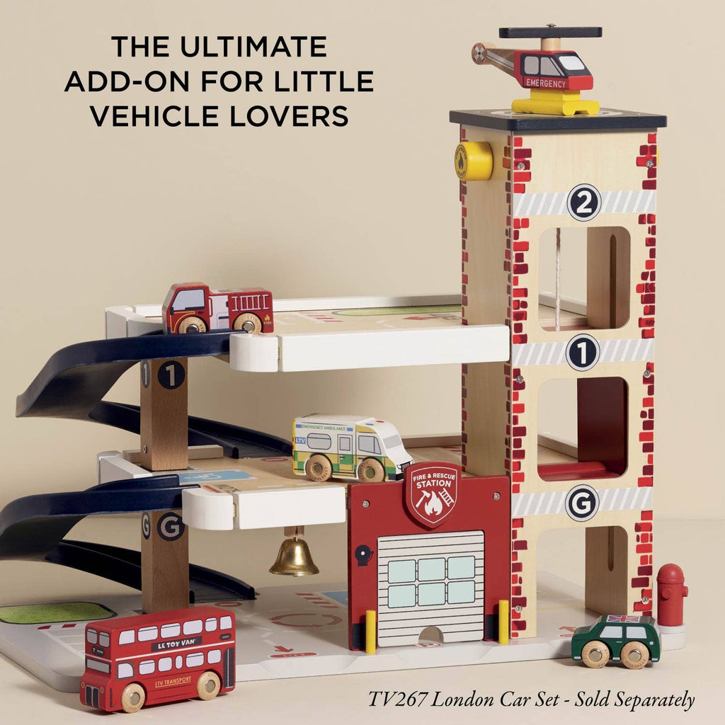 The Fire & Rescue Garage is a wooden playset with ramps, fire engines, an ambulance, a helicopter, and a double-decker bus—perfect for imaginative play and vehicle fans. TV267 London Car Set sold separately.