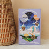 A whimsical 40-piece puzzle, “Sky High Friends 40 Piece Mini,” comes in a purple box featuring animals riding in hot air balloons across a starry sky above a colorful landscape. The packaging reads “Sky High Friends,” “once upon a puzzle,” is suitable for ages 4 and up, and sits next to a charming wicker basket—making it the perfect choice to spark young imaginations.