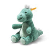 The Steiff Joshi Baby T-Rex Dinosaur is a soft, green plush toy featuring a white belly, white spikes along its back, and a yellow tag on its head. This adorable baby dino sits upright against a white background—making it the perfect prehistoric toy and cuddly friend for any little one.