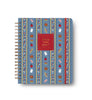 The 2027 Schoolhouse 17-Month Academic Hardcover Spiral Planner is a large spiral-bound planner for 2026-2027, featuring a vibrant blue cover adorned with apples, books, pencils, erasers, and lined paper arranged in vertical rows.