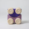 Grimm's Stacking Cars - Purple (coming soon) is a wooden toy car with four light-colored wheels and a purple body, shown upright on a plain white background.