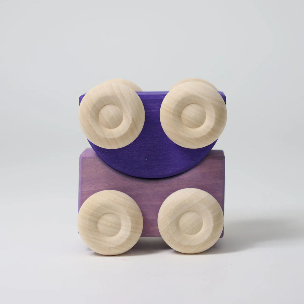 Grimm's Stacking Cars - Purple (coming soon) is a wooden toy car with four light-colored wheels and a purple body, shown upright on a plain white background.