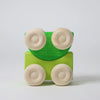 Grimm's Stacking Cars - Green (coming soon) features a minimalist green body and four unpainted wooden wheels, ideal for fans of color matching toys. Shown on a plain white background.