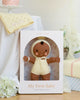 Cuddle + Kind My First Baby (Buttercup), a fair trade, hand-knit brown-skinned doll in a cream outfit and bonnet, is made from natural cotton yarn and helps feed 10 children with every purchase. Ships in one week.