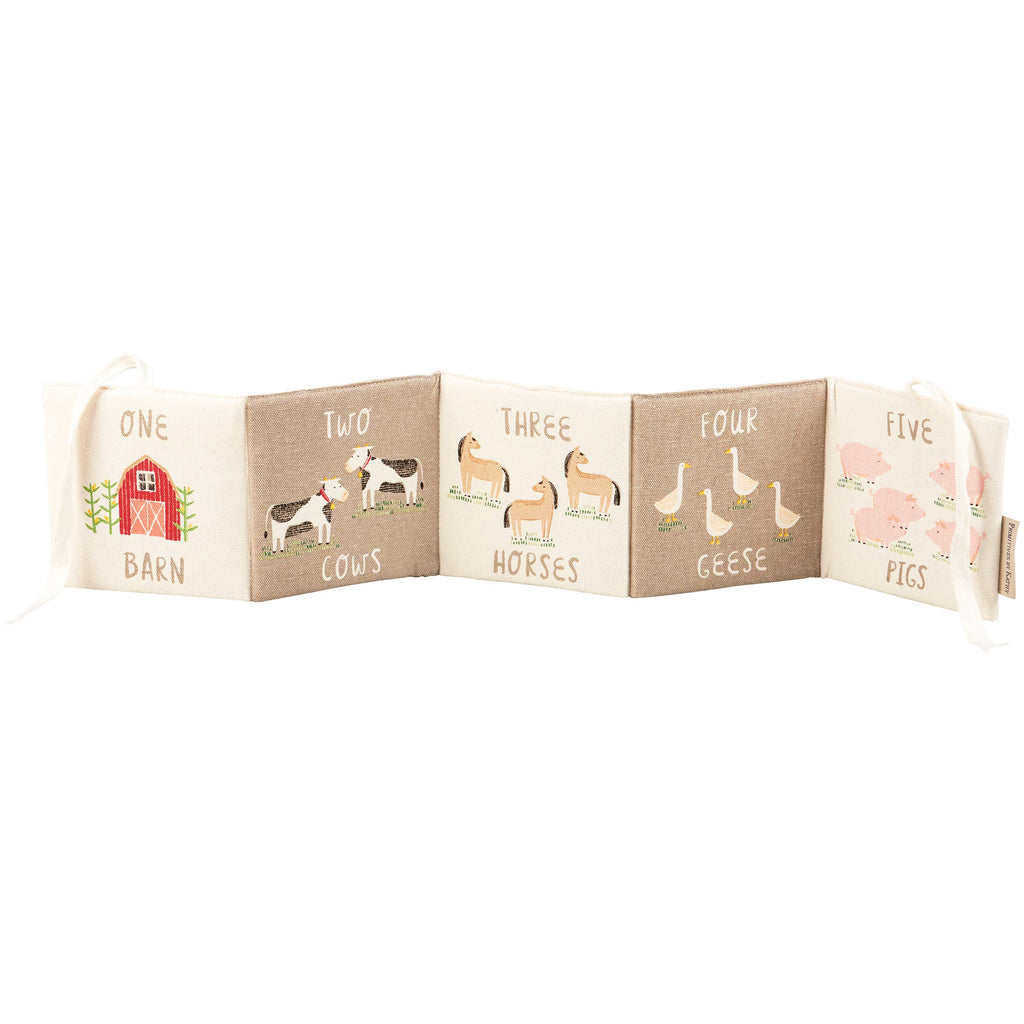 The Little Farm Soft Book features embroidered farm animals and numbers—one barn, two cows, three horses, four geese, five pigs—plus charming text and illustrations. A delightful farm-themed gift for infants.