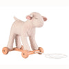 A Pull-Along Mary Lamb on wooden wheels, with a soft, fluffy body and natural wood wheels, connected to a pull string. The lamb has closed eyes and is in a standing position.