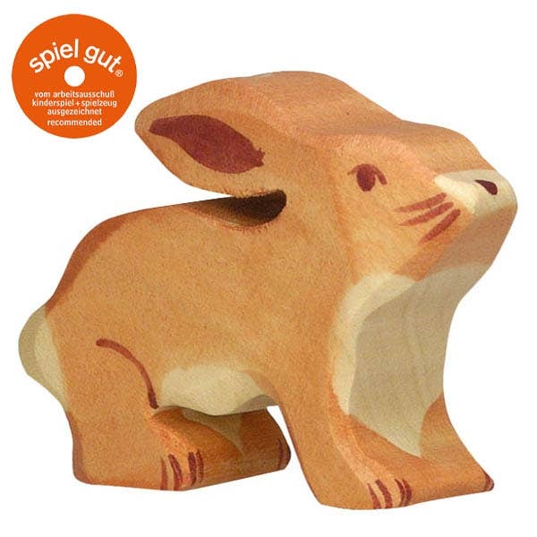 The Holztiger Rabbit is a handcrafted wooden toy in natural brown and cream, with simple painted features and the orange "spiel gut" seal. Made in Europe, it showcases HOLZTIGER's renowned quality and care in every detail.