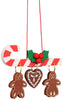 The Christian Ulbricht Ornament - Candy Cane Ornament is a festive decoration featuring a candy cane with red stripes, embellished with green holly and red berries. It’s crafted in Germany, and hanging from it are two gingerbread figures and a heart-shaped cookie, all adorned with white icing patterns.