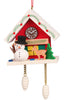 The Christian Ulbricht Ornament - Snowman with Red Cuckoo Clock is a festive wooden collectible shaped like a house with a clock, featuring a snowman, deer, tree, pinecone weights, and bright holiday colors showcasing fine German craftsmanship.