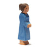 A wooden figurine of a woman with long hair tied in a bun, wearing a simple blue dress. The figurine has a flat base, allowing it to stand upright, and boasts minimal facial details, giving it an Ostheimer Mother, Blue Dress handcrafted appearance perfect for imaginative play.