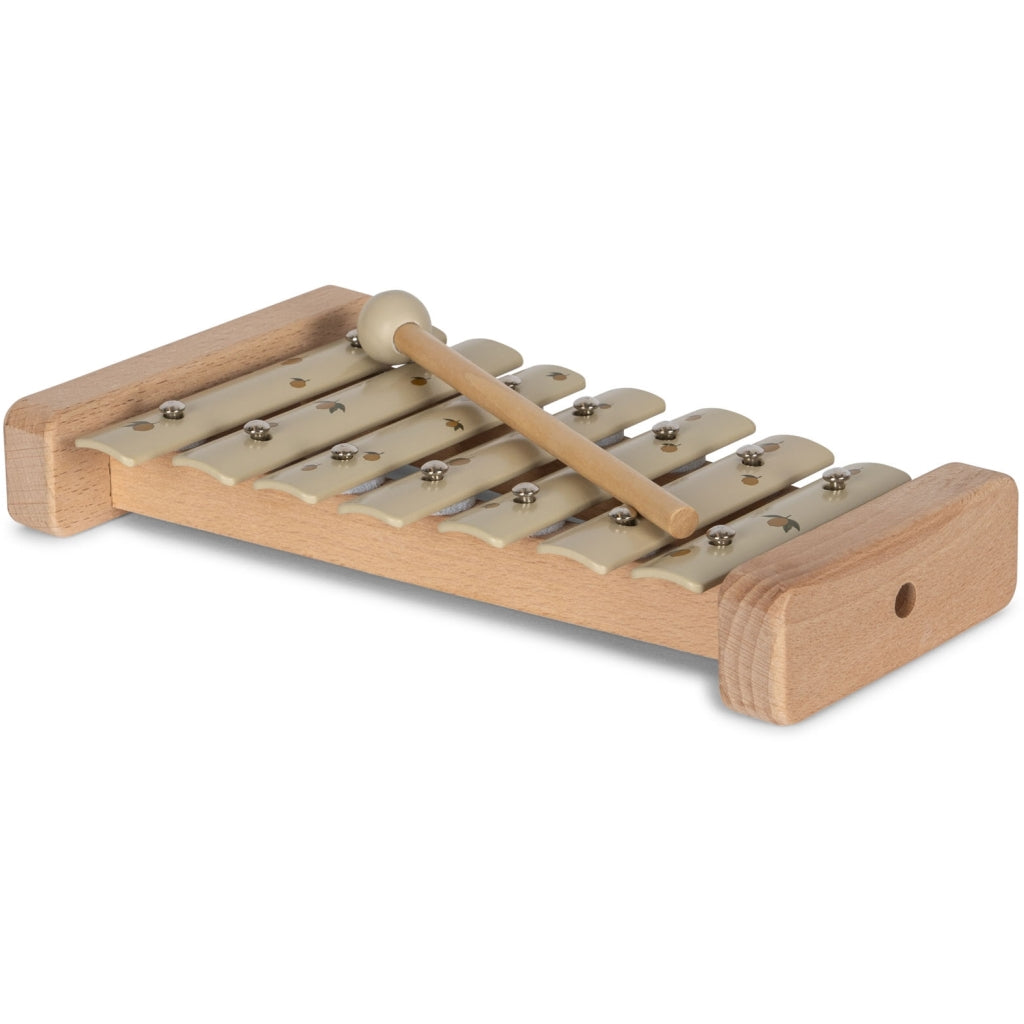 A Lemon wooden xylophone with a series of metal keys attached, accompanied by a small wooden mallet lying on top, set against a white background.