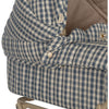 Close-up of a blue checkered Doll Pram with wooden button and small daisy embellishment on a quilted printed fabric.