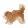 A Ostheimer Small Saint Bernhard Dog - Head Down figure, carved in a simplistic style with visible wood grain, displayed against a plain white background.