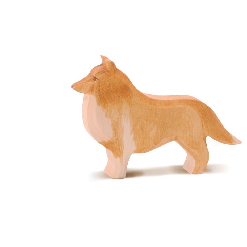 The Ostheimer Collie Dog is a handcrafted wooden figurine with a natural wood finish, reminiscent of traditional Ostheimer toys. Designed to resemble a Collie standing on all fours, this toy features a smooth texture and is beautifully shaded in light brown with lighter accents, perfect for sparking imaginative play. Displayed against a white background, it captures the charm and simplicity of artisan craftsmanship.