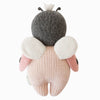 The Cuddle + Kind Baby Ladybug is a hand-knit plush toy crafted from natural Peruvian cotton yarn, featuring a dark gray head, pink body, cream and pink wings, and two small black antennae. Shown from the back.