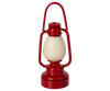 A red lantern-shaped item with a cream center and curved top handle, reflecting the whimsical look of the Maileg Little Rabbit’s Bathroom Set, is displayed against a plain white background.