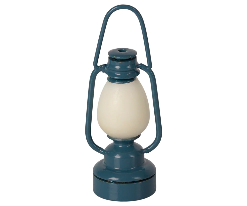 The Maileg Camping Set with Brother and Sister features a vintage-style blue lantern with a rounded white center, perfect as a decorative accessory for SuitCasa homes, displayed against a plain white background.