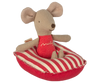 A small Maileg mouse toy sits on the Maileg Rubber Boat, Small Mouse - Red Stripe. With stitched features and large round ears, it's perfect for pairing with other Maileg mouse accessories.