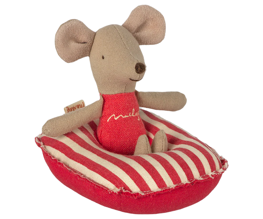 A small Maileg mouse toy sits on the Maileg Rubber Boat, Small Mouse - Red Stripe. With stitched features and large round ears, it's perfect for pairing with other Maileg mouse accessories.