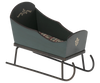The Maileg Sleigh, Mouse - Green is a small decorative wooden sleigh with white painted designs, a patterned fabric seat, and curved metal runners—ideal as dollhouse furniture or for miniature mice accessories.