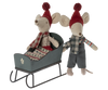 The Maileg Sleigh, Mouse - Green features two mice in red hats and winter clothes, making it a charming accessory for dollhouse furniture or festive displays.