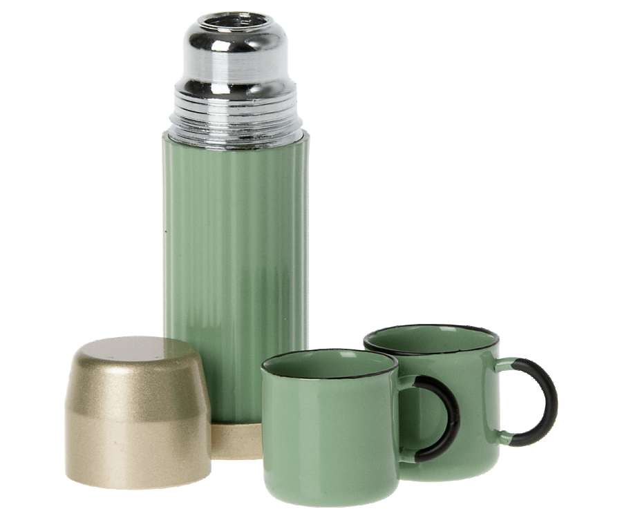 The Maileg LouiMax Little Explorer Set features a green thermos with a metallic lid, two matching mugs, a gold-colored cup, and a miniature lantern, all displayed on a plain white background.