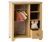 A Maileg Wardrobe, Large - Yellow with an open door revealing a floral patterned interior, hanging knitted clothes, and a drawer slightly open with items inside.