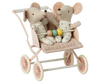 Two Maileg Stroller, Baby Mice - Rose in a vintage pink double stroller, with one mouse holding a colorful bead toy. The stroller and mice are set against a transparent background.