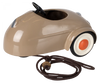 A Maileg Mouse Car - Light Brown with a simplistic design featuring large white wheels with red hubs and a black steering wheel. The car has an attached dark leather pull string.