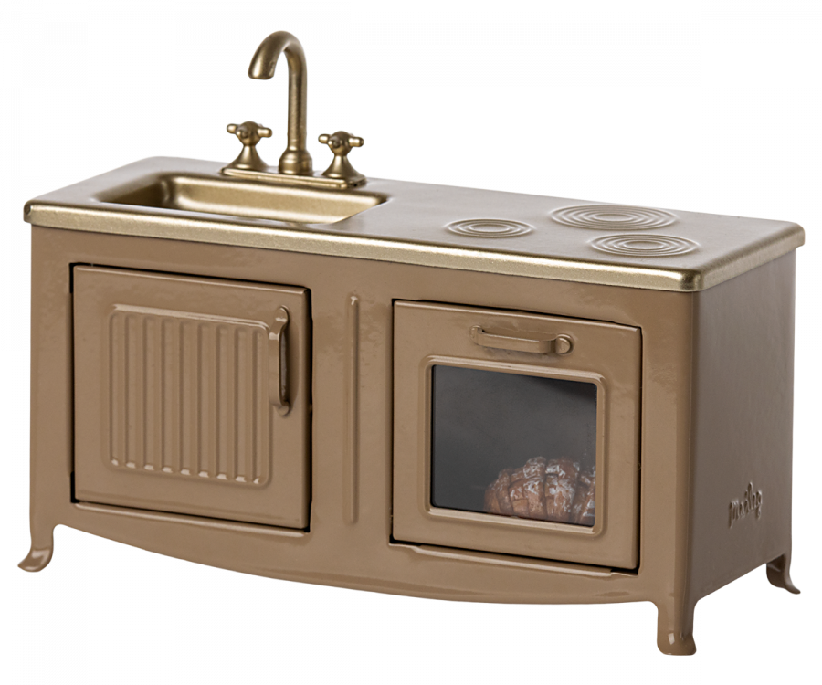 A Maileg Kitchen - Light Brown miniature playset in gold, featuring a sink, stovetop, and an oven with a visible pie inside, designed for children's play.