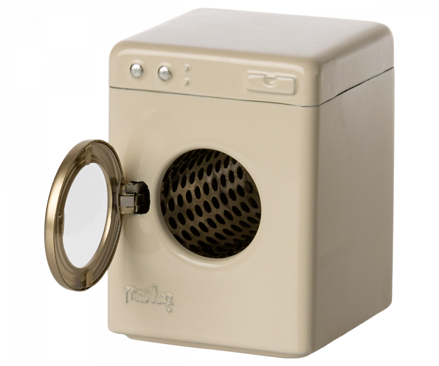 A small, vintage-inspired, cream-colored Maileg Washing Machine For Mice with a transparent circular door on the front and a black, honeycomb-patterned interior.