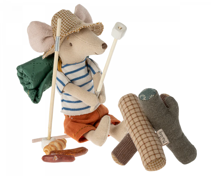 A Maileg Happy Camper Set - Gift Wrapped, dressed in a sailor's outfit with a backpack and walking stick, standing next to a plush beaver holding a fish and a fishing rod, both on a transparent background.