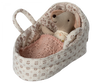 A small stuffed mouse cuddled in a cozy, floral-patterned fabric bassinet with a knitted pink blanket. The mouse appears to be comfortably resting or sleeping in the soft Maileg Carry Cot, Baby.