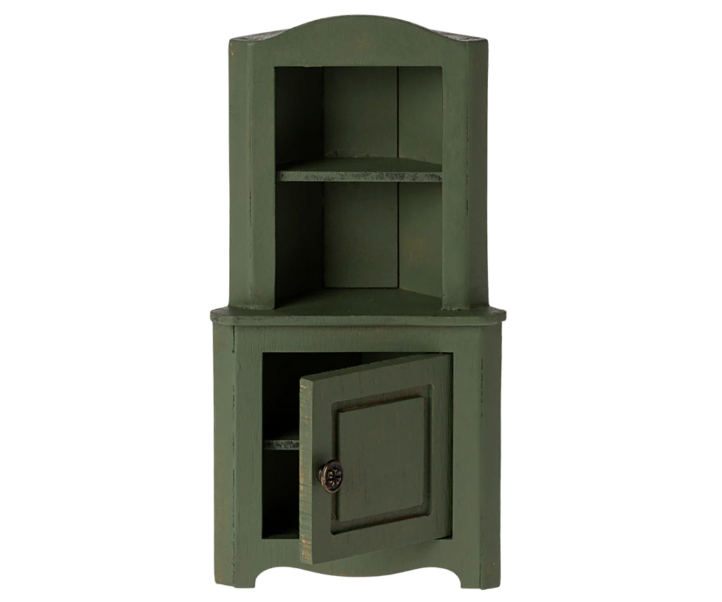 The Maileg Corner Cabinet, Mouse - Dark Green is a vintage-inspired piece crafted with a distressed finish for an antique look. It features an open compartment at the top, a middle shelf, and a closed compartment at the bottom with one door slightly ajar, making it perfect for stylish home decoration.