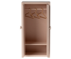 A cute, light rose Maileg Mouse Closet with open doors reveals a charming space for a mice family. Inside, three golden hangers gleam on the top rod above an empty shelf, ideal for displaying a children's toy collection. Ships in approximately one week.