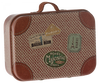 The Maileg Suitcase, Micro is a vintage-style small metal suitcase with brown leather accents and colorful illustrations, adorned with travel stickers from various destinations such as "Hotel Majestic Paris" and "Baggage Room." Perfect for storing small items, it also features a sturdy handle on top.