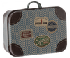 The Maileg Suitcase, Micro is a small, vintage-style suitcase featuring a blue patterned fabric exterior and dark brown leather corners. This charming metal suitcase is adorned with vibrant illustrations and travel stickers, including ones for Hotel Chatham Paris, Hotel Majestic Paris, and Camembert Maileg—ideal for storing small items.