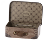 The image displays the Maileg Suitcase, Micro, a small vintage-style metal suitcase perfect for storing small items. The interior is adorned with a brown and beige floral pattern, while the exterior features a houndstooth design complemented by brown leather accents and a handle secured with brass rivets.