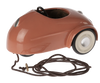 Maileg Mouse Car - Coral in a shiny copper color with a visible seat and steering wheel, and a brown power cord attached to the side.